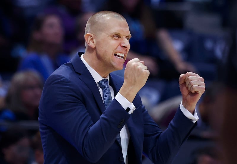 BYU basketball coach Mark Pope cheers on his team against San Diego State at BYU’s Marriott Center in Provo.