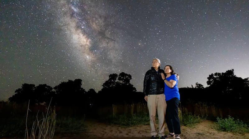 Elder Gerrit W. Gong and his wife, Sister Susan Gong, look at the Milky Way late at night in the desert of Southern Utah.