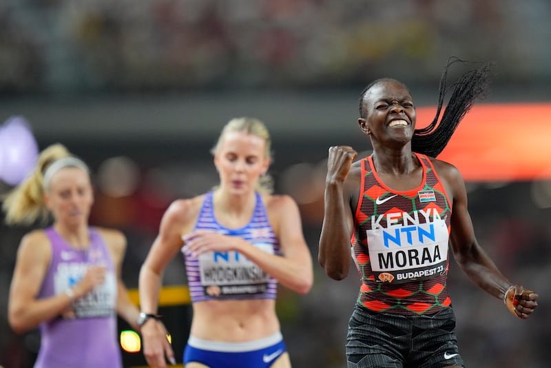 Mary Moraa, of Kenya celebrates as she wins the gold medal ahead of Keely Hodgkinson, of Great Britain in the final of the Women's 800-meters during the World Athletics Championships in Budapest, Hungary, Sunday, Aug. 27, 2023. (AP Photo/Petr David Josek)