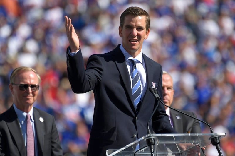 Former New York Giants quarterback Eli Manning speaks to the crowd in East Rutherford, N.J.
