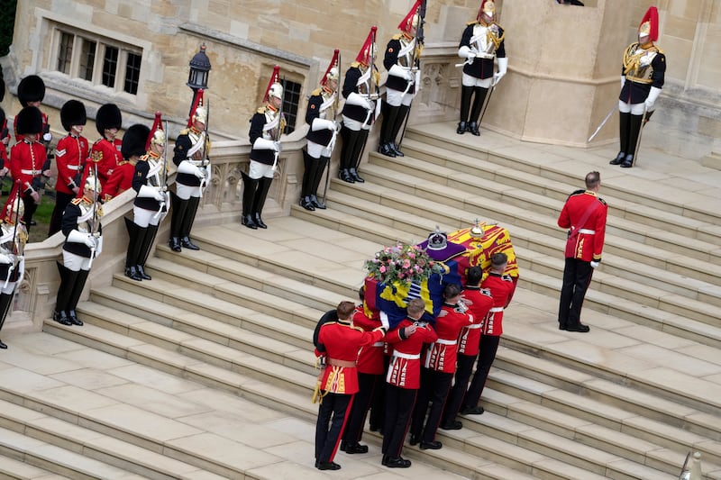 The coffin of Queen Elizabeth II is carried into Saint George’s chapel for her funeral at Windsor castle, Britain.