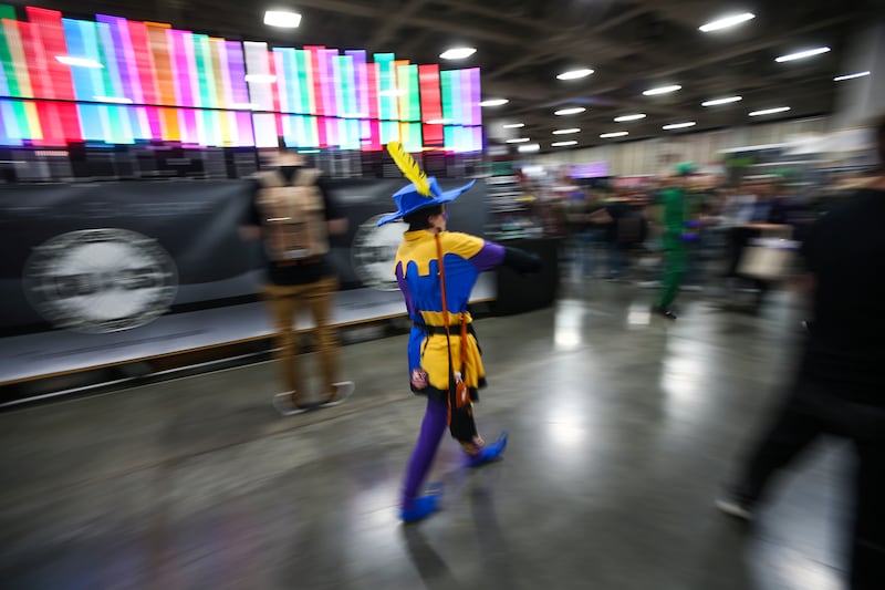 Cosplayers walk through the venue during the FanX Spring Comic Convention at the Salt Palace Convention Center in Salt Lake City on Friday, April 19, 2019.