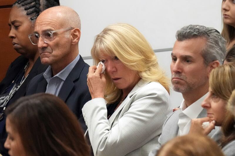 Mitch and Annika Dworet react as they hear that their son’s murderer will not receive the death penalty at the Broward County Courthouse.