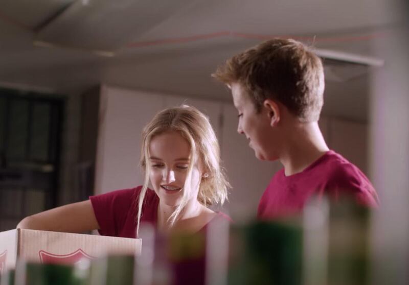 Evie Clair and Benson Baril offer service in a music video of "Light The World," a song composed by Baril's mother, Sara.