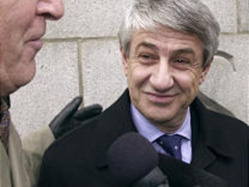 Jet Set Sports owner Sead Dizdarevic, right, and attorney Bill Purcell leave court on Tuesday.