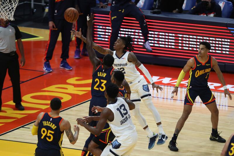 Memphis Grizzlies’ Ja Morant (12) shoots against the Golden State Warriors during an NBA play-in  tournament game May 21, 2021.