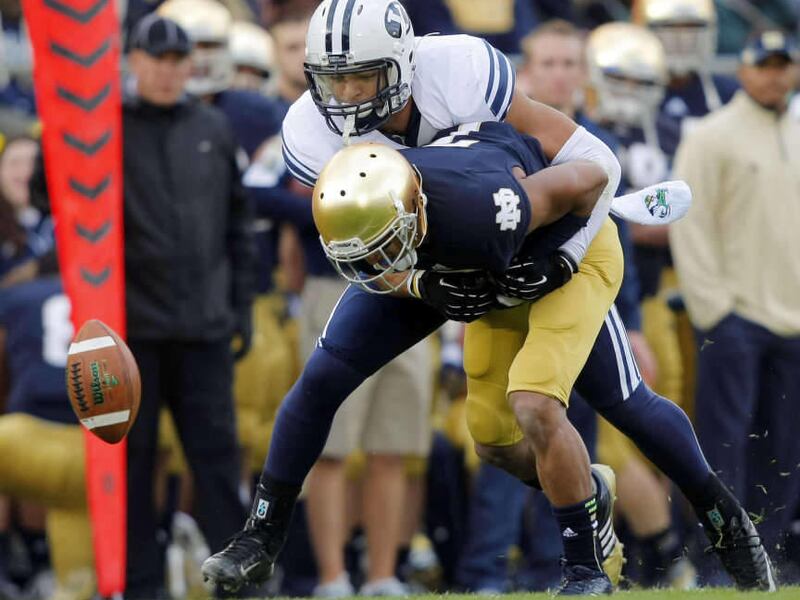 BYU's #3 Kyle Van Noy defends Notre Dame's #7 TJ Jones as BYU and Notre Dame play Saturday, Oct. 20, 2012 in South Bend.