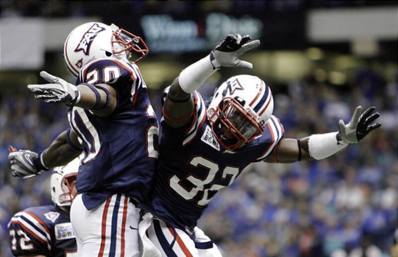 Florida Atlantic running back Charles Pierre, left, and teammate Kyle Watkins celebrate Watkins' touchdown in the first half Friday.