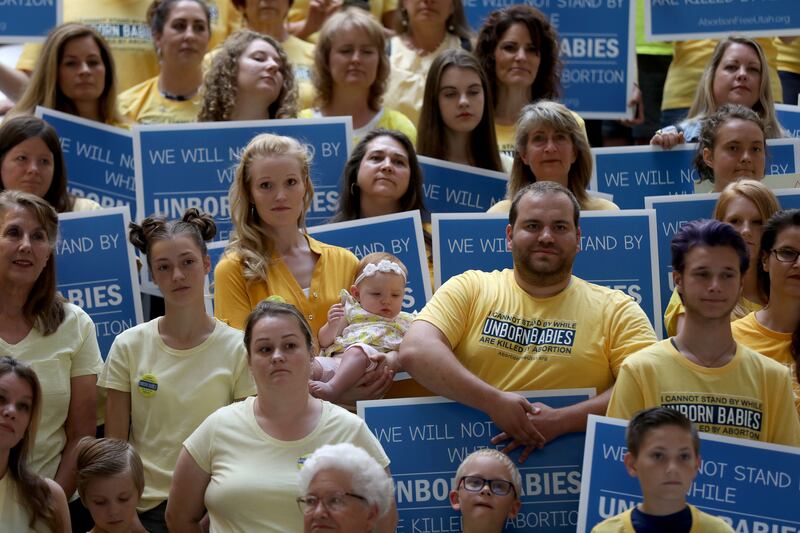FILE - Members of the new group Abortion-Free Utah launch a campaign to end elective abortion in the state at the Capitol in Salt Lake City on Wednesday, June 19, 2019.