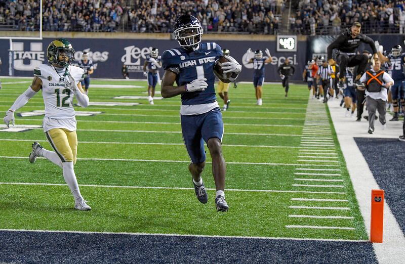 Utah State receiver Jalen Royals runs into the end zone for a touchdown against Colorado State Saturday, Oct. 7, 2023, in Logan, Utah.