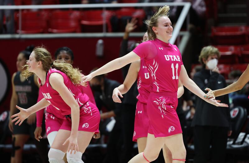 Utah Utes guard Brynna Maxwell and Utah Utes guard Gianna Kneepkens celebrate the win over the Washington State Cougars.