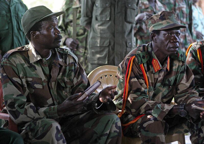 FILE - In this Nov. 12, 2006 file photo Joseph Kony, the Lord's Resistance Army (LRA) leader, left, and his deputy Vincent Otti, sit inside a tent at Ri-Kwamba in Southern Sudan. A video by the advocacy group Invisible Children about the atrocities carri