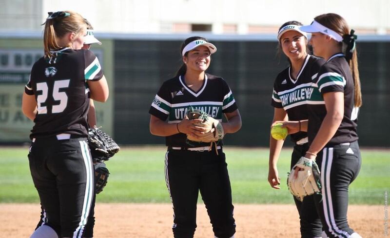 The UVU infield gathers together during a fall exhibition softball game at Wolverine Field in September.