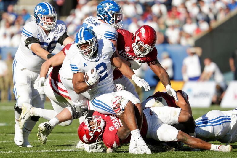 BYU running back Chris Brooks carries the ball against Arkansas Razorbacks in Provo on Saturday, Oct. 15, 2022.