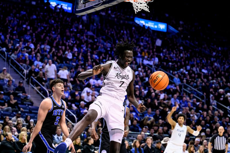 UCF center John Bol (7) yells after a dunk during game against BYU, Tuesday, Feb. 24, 2026, in Provo, Utah.