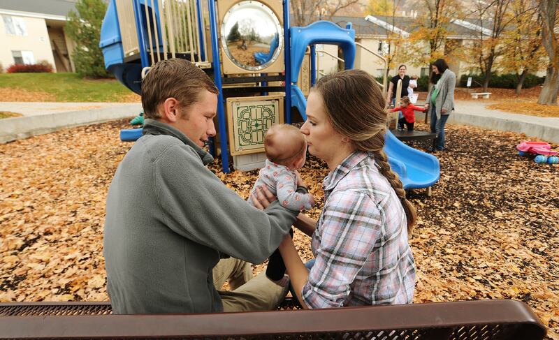 Spencer and Lauren Hanson sit with daughter Lyla in Provo on Nov. 4, 2017. They have been married two years.