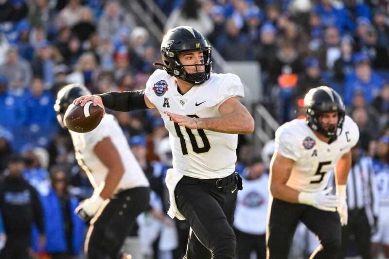 UCF quarterback John Rhys Plumlee looks to throw