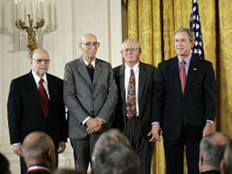 Rodney D. Bagley, third from left, is among the team of Corning scientists honored by President Bush, right, at the White House Monday.