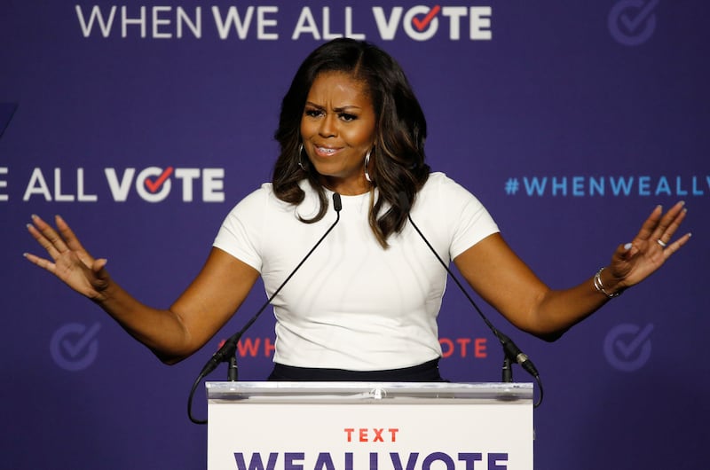 FILE - In this Sept. 23, 2018, file photo former first lady Michelle Obama speaks at a rally to encourage voter registration in Las Vegas. (AP Photo/John Locher, File)