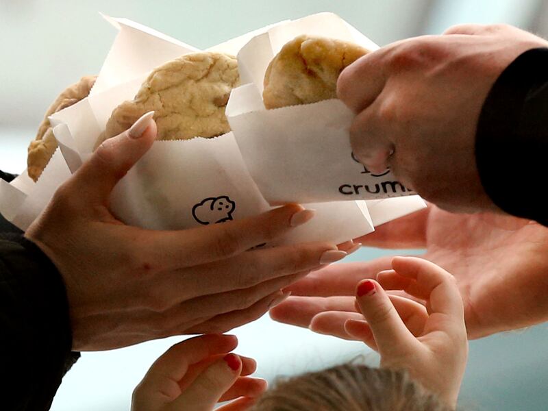 Family members grab a cookie after leaving Crumbl in Lehi on Friday, Dec. 21, 2018.