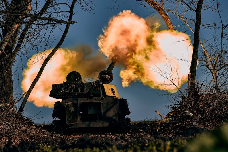 A self-propelled artillery vehicle fires near Bakhmut, Donetsk region, Ukraine, on Wednesday, Nov. 9, 2022.