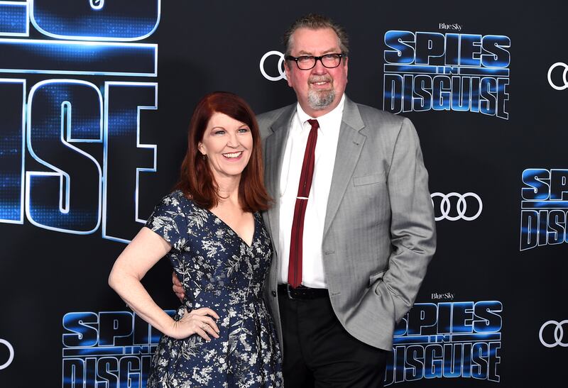 Kate Flannery, left, and Chris Haston arrive at the world premiere of “Spies in Disguise” at the El Capitan Theatre on Wednesday, Dec. 4, 2019, in Los Angeles.
