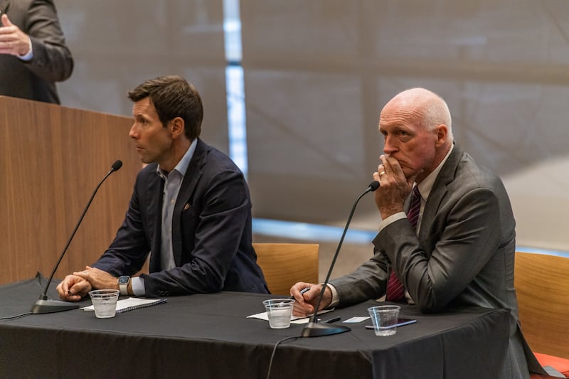 Arizona House Speaker Rusty Bowers, right, listens as 1st Amendment Partnership President Tim Schultz speaks in Phoenix.