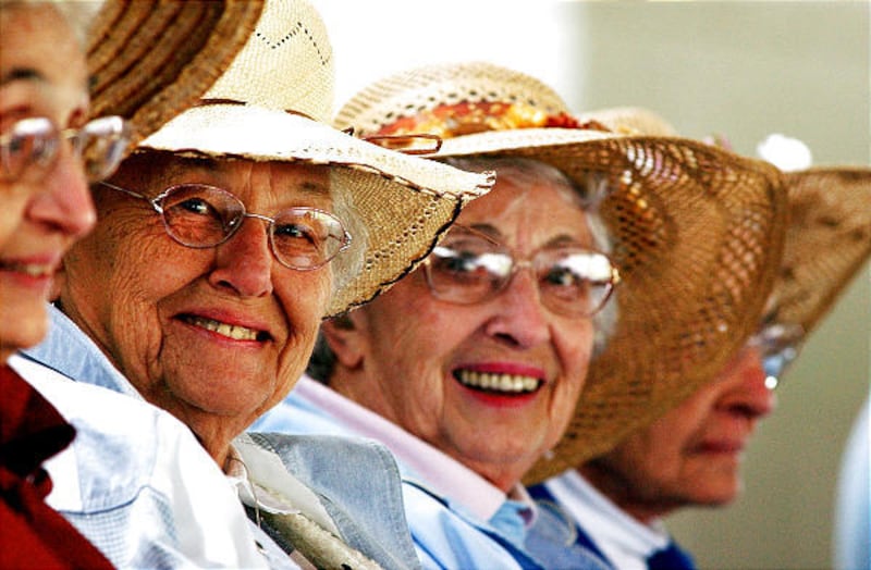 In this May 7, 2003 file photograph, biological sisters including Pauline Gehrs, 85, from left, Esther Gehrs, 90, Ruth Flett, 86, and Marge Thurman, 94, get together to watch a Chicago Cubs game like they did as young girls from Chicago.