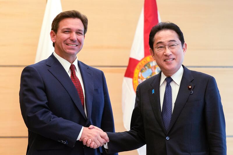 Florida Gov. Ron DeSantis shakes hands with Japanese Prime Minister Fumio Kishida at the prime minister’s residence in Tokyo.