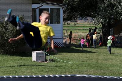 The Wilde children play in their yards in Croydon, Morgan County, on Thursday, Aug. 9, 2018. State GOP Rep. Logan Wilde runs a sheep ranch with his brothers Albert and Edwin.