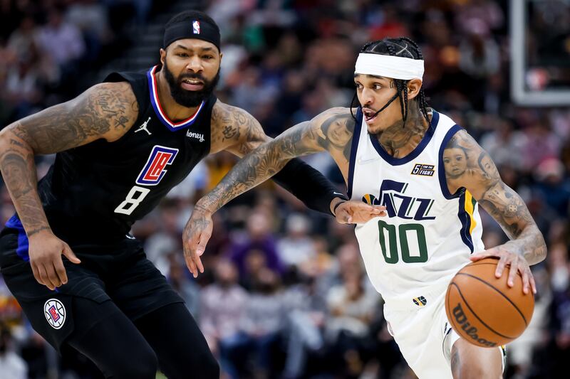 Utah guard Jordan Clarkson drives against Clippers forward Marcus Morris Sr. during game at Vivint Arena in Salt Lake City.