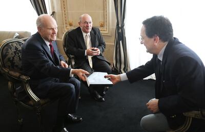 President Russell M. Nelson of The Church of Jesus Christ of Latter-day Saints, left,  gives a copy of his biography to Sergio Rubin, Argentine journalist and biographer of Pope Francis, after an interview in Montevideo, Uruguay on Oct. 26, 2018. Carlos A