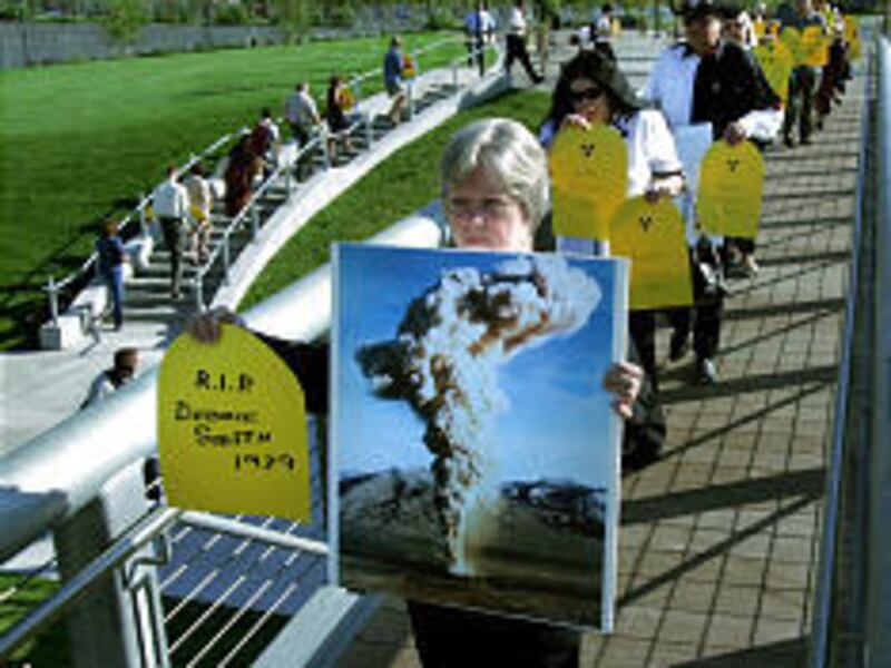 Demonstrators at Salt Lake Library hold signs bearing names of loved ones who died of cancer.