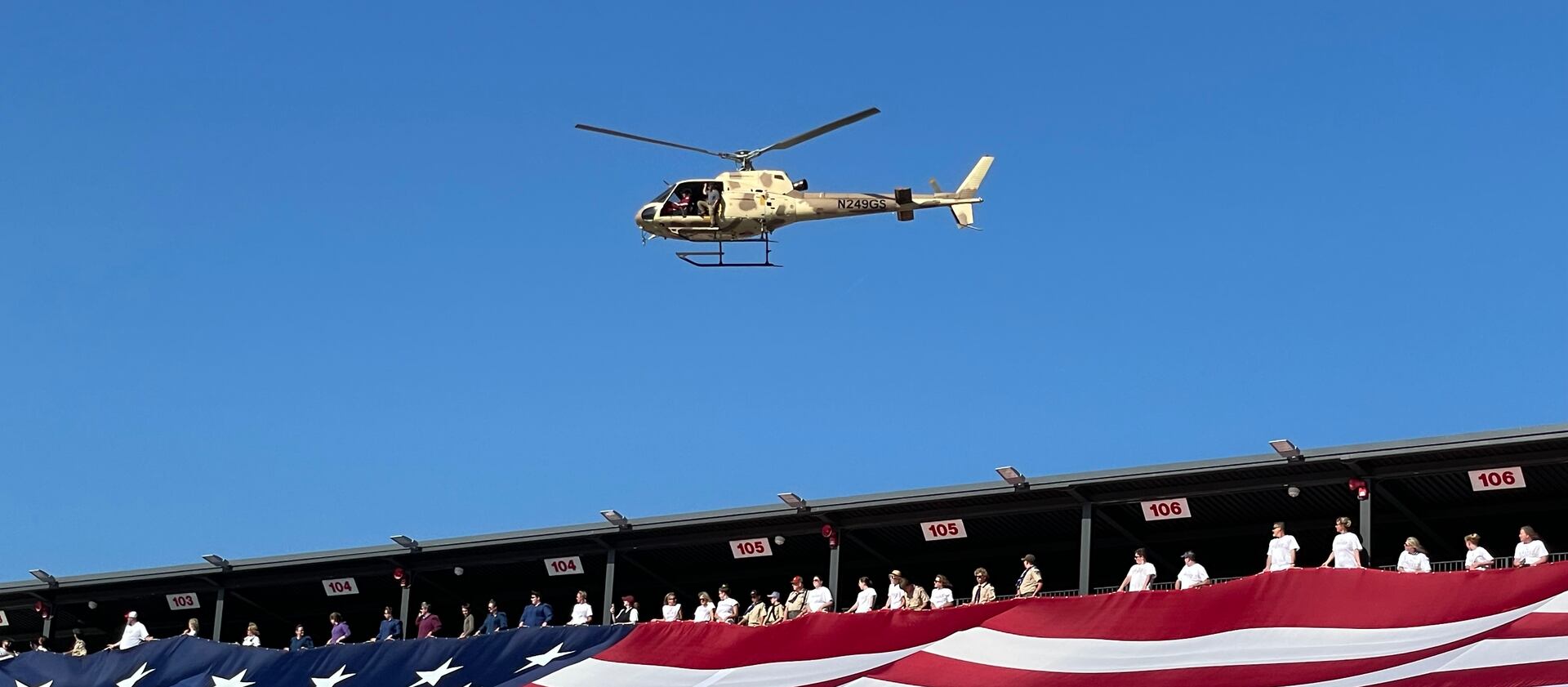 Gail Halvorsen flys over Dixie State University’s Greater Zion Stadium in a helicopter.