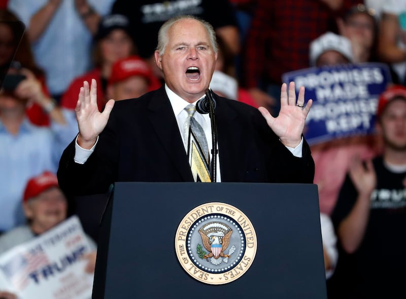 Radio personality Rush Limbaugh introduces President Donald Trump at a campaign rally in Cape Girardeau, Mo., on Nov. 5, 2018.