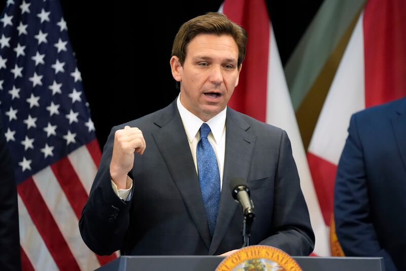 Florida Gov. Ron DeSantis speaks at a news conference in Lake Buena Vista, Fla.