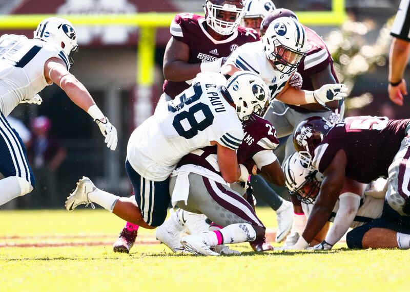 BYU linebacker Butch Pau'u tackles Mississippi State running back Aeris Williams during the first half at Davis Wade Stadium in Starkville, Miss., on Saturday, Oct. 14, 2017.