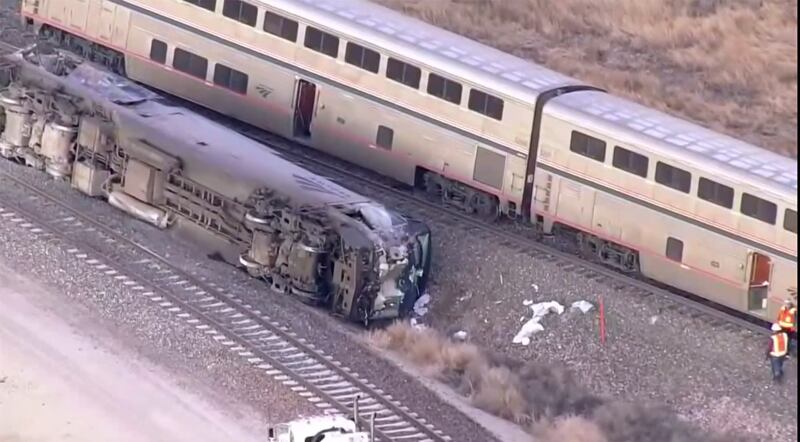 Emergency responders look over an Amtrak train derailment on Tuesday, Jan. 30, 2024, near Keenesburg, Colo.