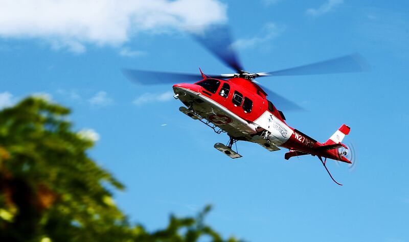 An Intermountain Health Life Flight helicopter lands at the scene of a mock car crash at Murray High School.