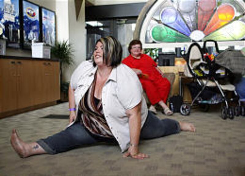 Nichole Martin, 28, shows her flexibility while waiting to audition for "The Biggest Loser" Saturday.