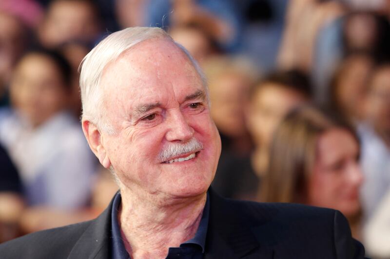 English actor John Cleese poses for a photo as he walks on the red carpet to receive Sarajevo Film Festival's top honor award, the Heart of Sarajevo Award, in Sarajevo, Bosnia, on Wednesday, Aug. 16, 2017.