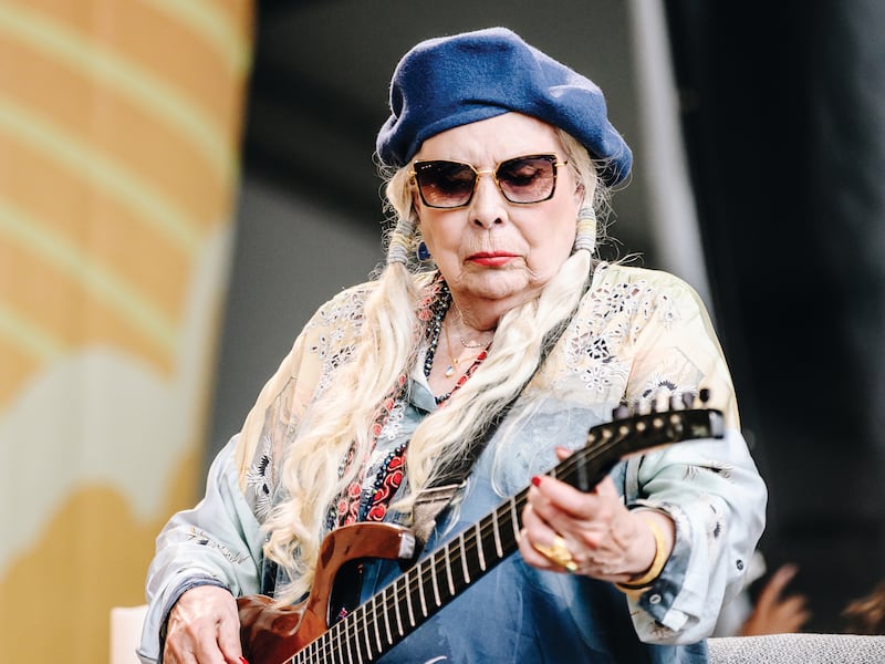 Joni Mitchell performs at the Newport Folk Festival.