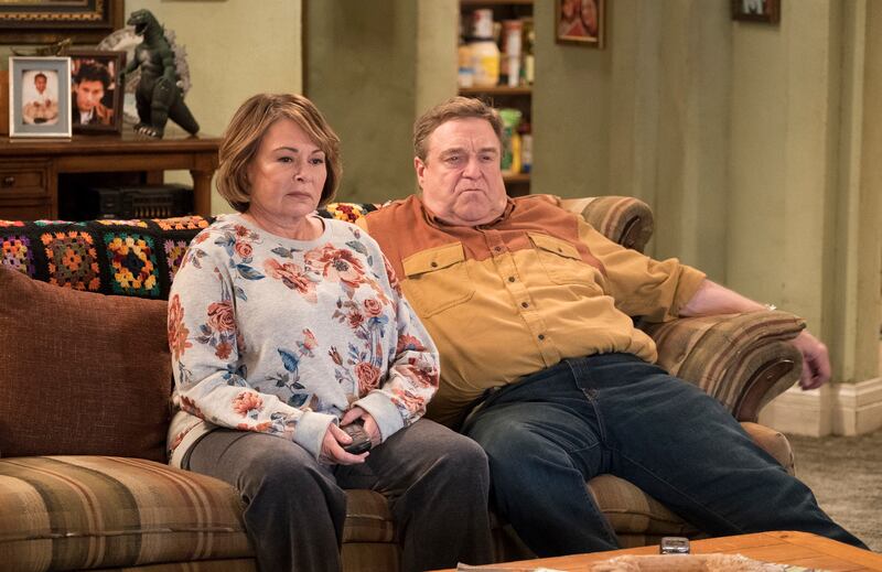 In this image released by ABC, Roseanne Barr, left, and John Goodman appear in a scene from the reboot of "Roseanne," premiering on Tuesday at 8 p.m. EST. (Adam Rose/ABC via AP)