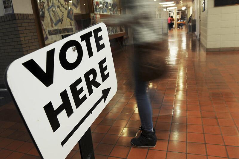 Voters head to the polls at Benton Harbor High School on Election Day Tuesday, November 4, 2014, in Benton Harbor, Mich.