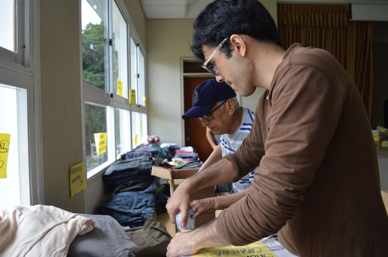 Volunteers from The Church of Jesus Christ of Latter-day Saints sort and package donated clothes for survivors of the earthquakes in Venezuela on June 29, 2026.