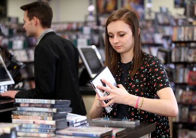 Matti Earl checks in videos at Top Hat Video in Bountiful on Friday, Jan. 26, 2018.