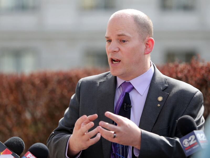 FILE - Sen. Daniel Thatcher talks to the media about the possible locations of Salt Lake County's third homeless resource center during an open house outside of the Senate Building at the Utah State Capitol campus in Salt Lake City on Saturday, March 18,