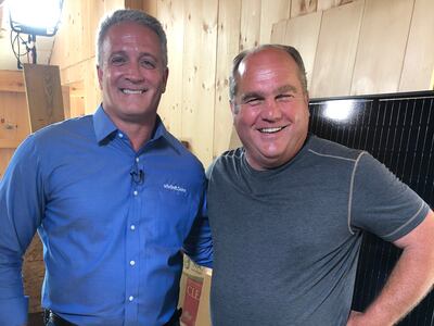 Vivint Solar Chief Information Officer Mark Trout, left, is pictured with Richard Trethewey from "This Old House," at a project for the 40th season of the popular PBS program in Rhode Island. Vivint designed and installed a solar panel system as part of t