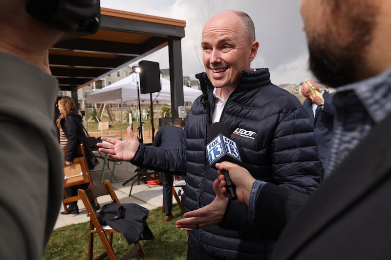 Gov. Spencer Cox talks with media after conducting a ceremonial bill signing in Herriman on April 18, 2023.