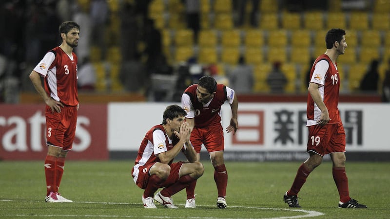 Syrian players react after losing a hard fought match against Japan during their AFC Asian Cup group B soccer match at the Qatar Sports Club in Doha, Qatar, Thursday Jan. 13, 2011.